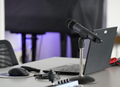 Laptop, conference table, mouse — IP TV Services with Easy Setup Guide