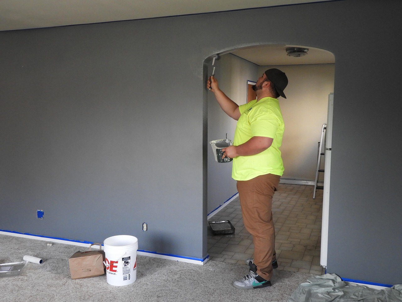 Painter, paint, house — "The Benefits of Choosing Professional Window Installation in Birmingham"